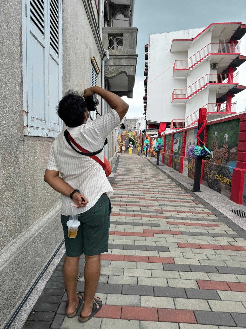 Kushal taking photos with a cool drink