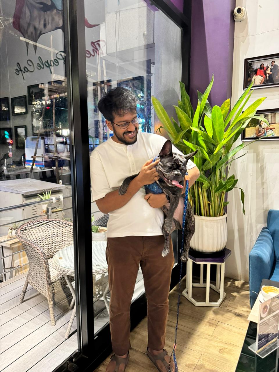 Kushal smiling with dog